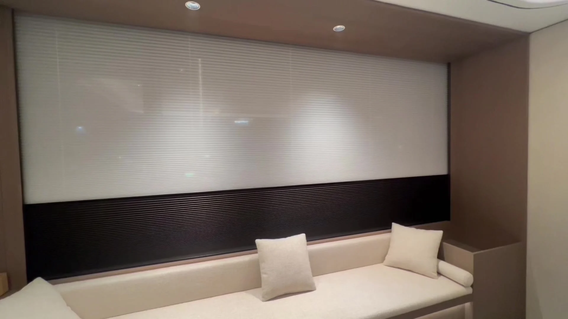 Day and night cellular shade in a warm, high-end interior