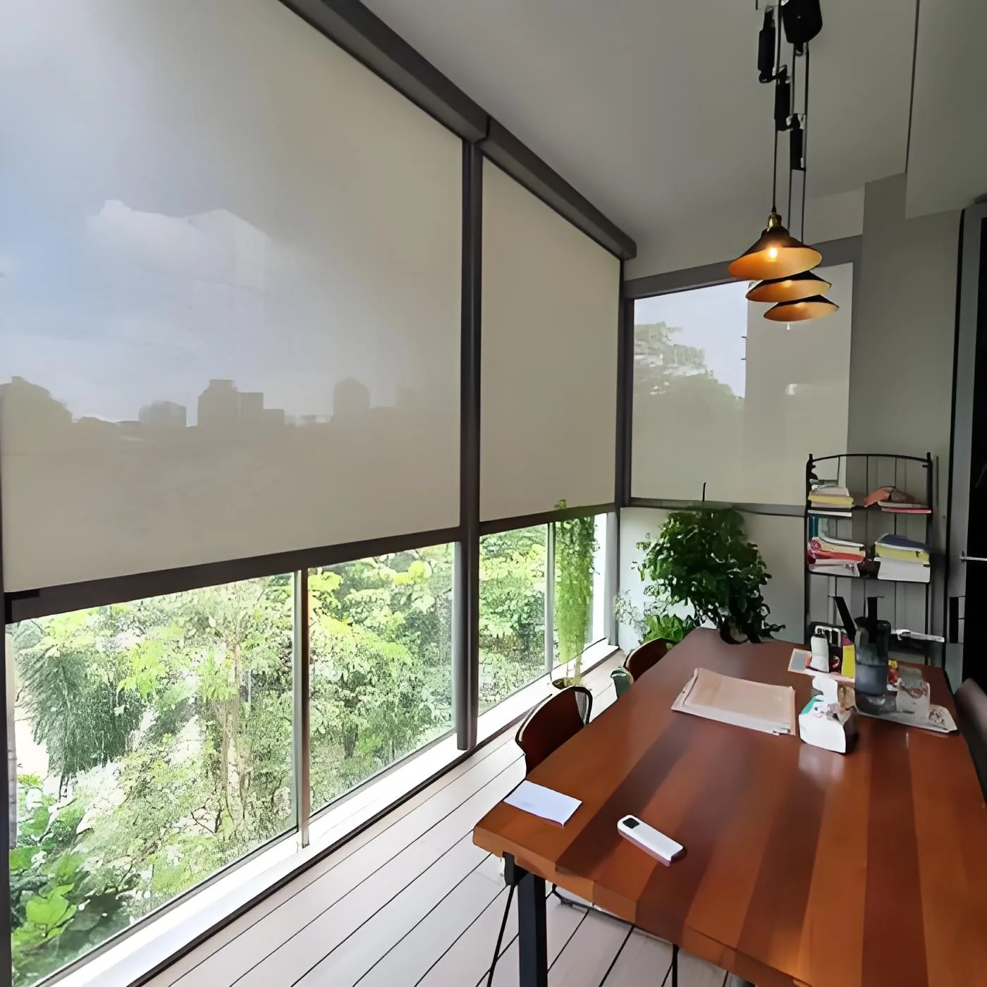 Motorised windproof outdoor roller shade on a balcony